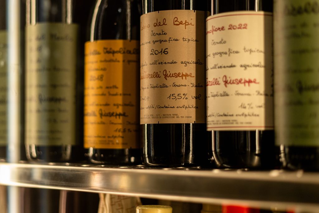 Bottles of Quintarelli Giuseppe on a shelf, including Rosso del Bepi 2016 and Primofiore 2022
