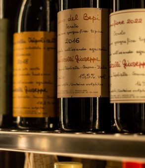 Bottles of Quintarelli Giuseppe on a shelf, including Rosso del Bepi 2016 and Primofiore 2022